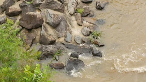 Close Up Overhead view looking down at river rocks in a swift fast moving, churn Stock Footage 286870372