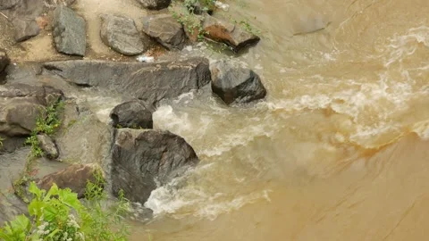 Close Up Overhead view looking down at river rocks in a swift fast moving, churn Stock Footage 286870484