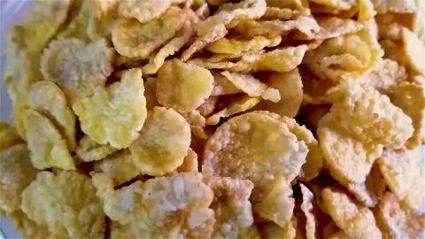 Close up overhead view of a pile of corn flakes rotating. Stock Footage 280216779