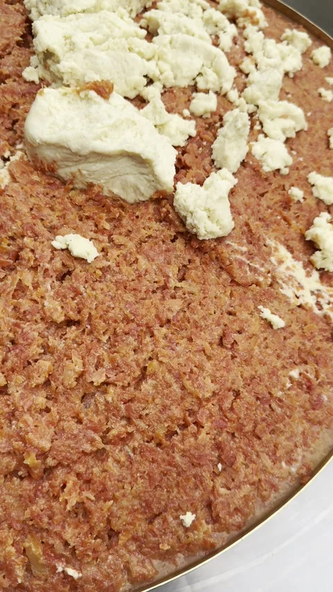 A close-up, overhead view of a textured, reddish-brown baked good, possibly.. Stock Footage 323612622