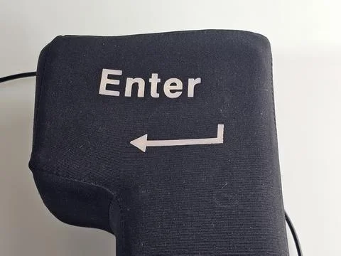 Close-Up of Oversized Enter Key with White Arrow Symbol Stock Photos