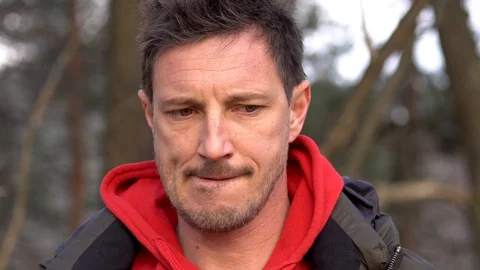 A close up of an overthinking stressed man looking into the camera Stock Footage 103998729