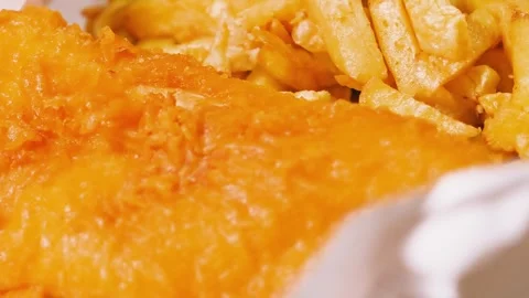 Close Up Overview of Classic British Fish and Chips Takeaway with Rustic Style Stock Footage 322558349