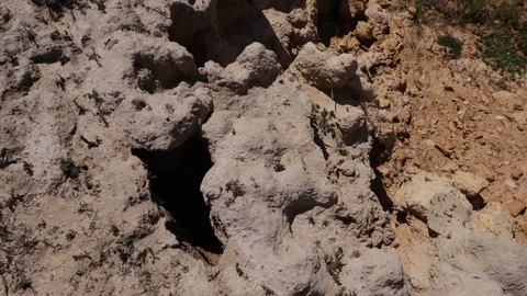 Close up overview of dry soil and low waterline alongside a lake during a Stock Footage 118750741