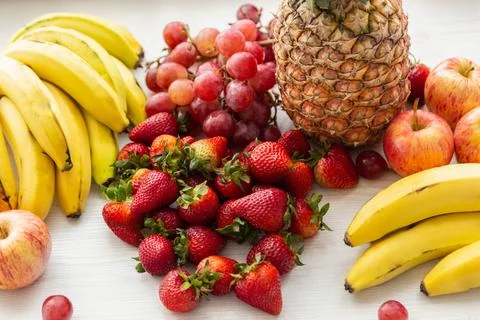 Close-p Different types of tropical fruits on white table Foto stock