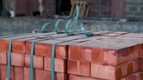 Close-up of packed orange bricks stacked into cube. Stock Footage 310052679