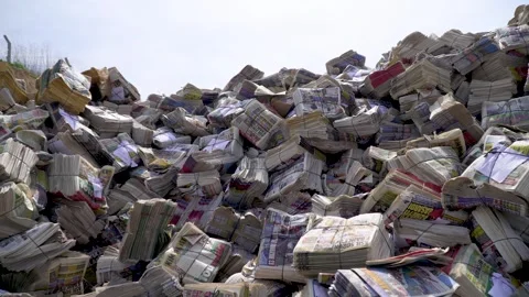A Close-Up on Packed Papers-folded and packaged newspapers find Video stock 287625476