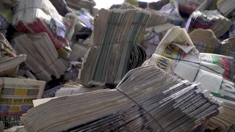 A Close-Up on Packed Papers-folded and packaged newspapers find Video stock 287625573