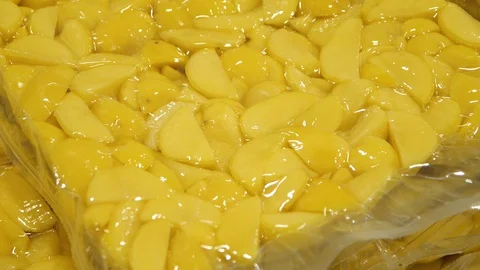 Close-up of Packed in plastic cutted potato for transportation. Supplier for Stock Footage 128205308