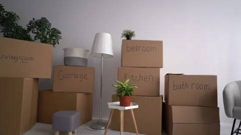 Close up of packed signed boxes and other things prepared for relocation Stock Footage 154310646