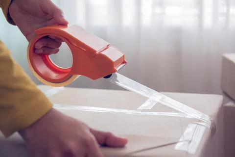 Close-up of packing a box. Stock-Fotos