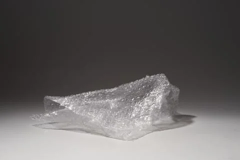 Close-up of packing bubble wrap on gray background Stock Photos