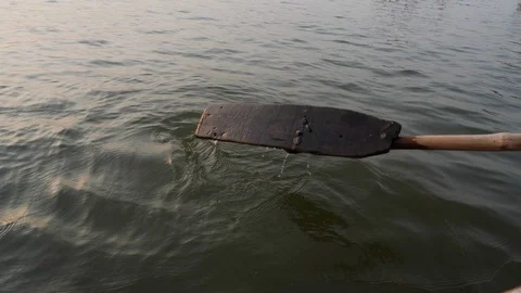 Close up of paddle in canoe moving in water during day time, Varanasi, India Stock Footage 145054343