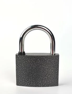 Close-Up Of Padlock On White Background . Stock Photos