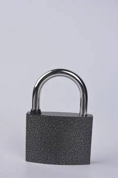 Close-Up Of Padlock On White Background . Stock Photos