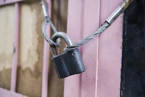 Close-Up Of Padlocks On Metal Cable Stock Photos