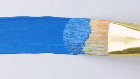 Close-up of paint brush and drawing oil painting. Painting blue line on canvas. Stock Footage