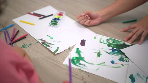 Close up paint brushes of Little cute girl creating and water color painting. Stock Footage 248663241