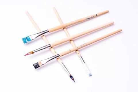 Close up of paint brushes on white background Stock Photos