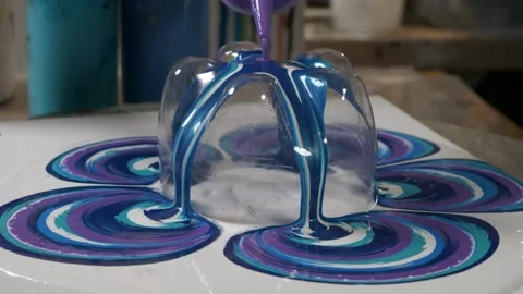 Close up. paint flowing on a canvas with a cut bottle. diy art and creation.. Stock Footage 238937403