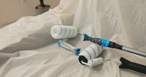 Close-up of paint rollers of different sizes. White and blue rollers with long 库存影片 218333711