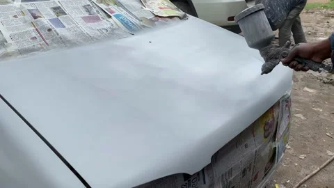 Close up of paint spray gun, worker painting a car Stock Footage 160987233