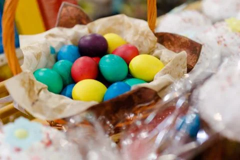 Close-up. Painted Easter eggs lie in a wicker basket. Stock Photos