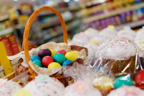 Close-up. Painted Easter eggs lie in a wicker basket. Stock Photos