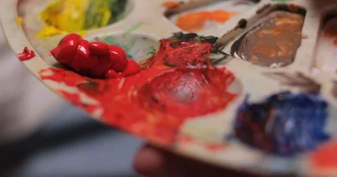 Close up of painter hand squeezed out on a palette acrylic dye Stock Footage 233907109