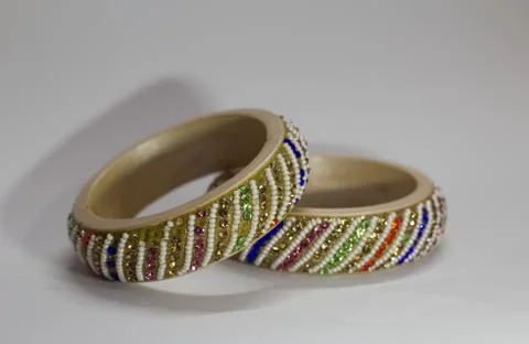 Close up of pair of bangles isolated on white background with space for text Stock Photos