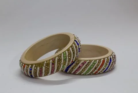 Close up of pair of bangles isolated on white background with space for text Stock Photos