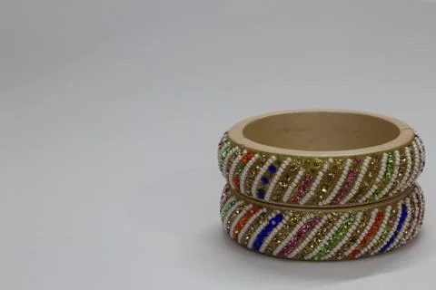 Close up of pair of bangles isolated on white background with space for text Stock Photos