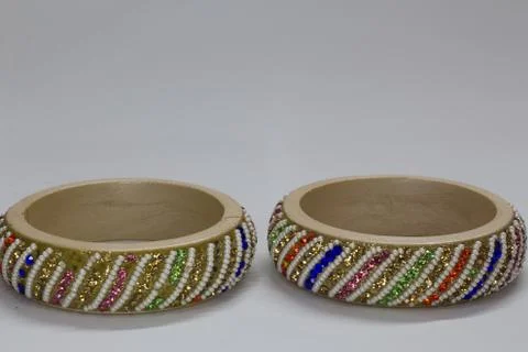 Close up of pair of bangles isolated on white background with space for text Stock Photos