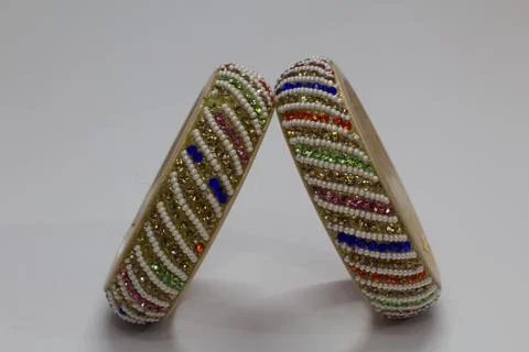 Close up of pair of bangles isolated on white background with space for text Stock Photos