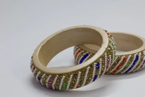 Close up of pair of bangles isolated on white background with space for text Stock Photos
