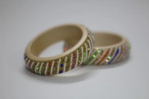 Close up of pair of bangles isolated on white background with space for text Stock Photos