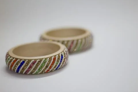 Close up of pair of bangles isolated on white background with space for text Stock Photos