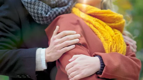 Close-up of the pair, a man embracing a beloved girl with a back holds gently on Stock Footage 143646719