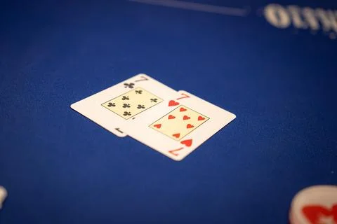 Close Up of Pair of Sevens on Blue Poker Table in Casino Setting Stock Photos