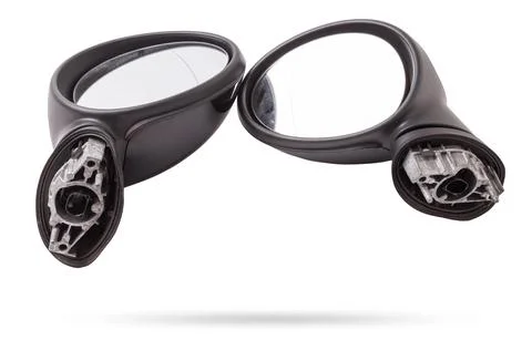 Close-up on a pair of side mirrors from a minibus with turn signal repeater.. Stock Photos