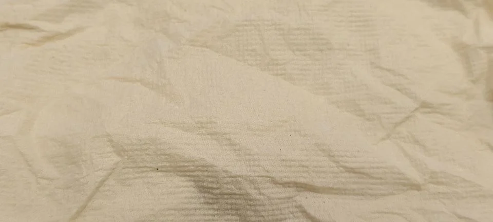Close‑up of a pale beige textured fabric Foto stock