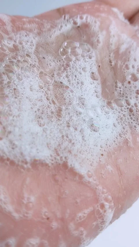 Close up of palm covered in soap bubble foam. Hand hygiene, cleansing bubbl.. Stock Footage 335022675