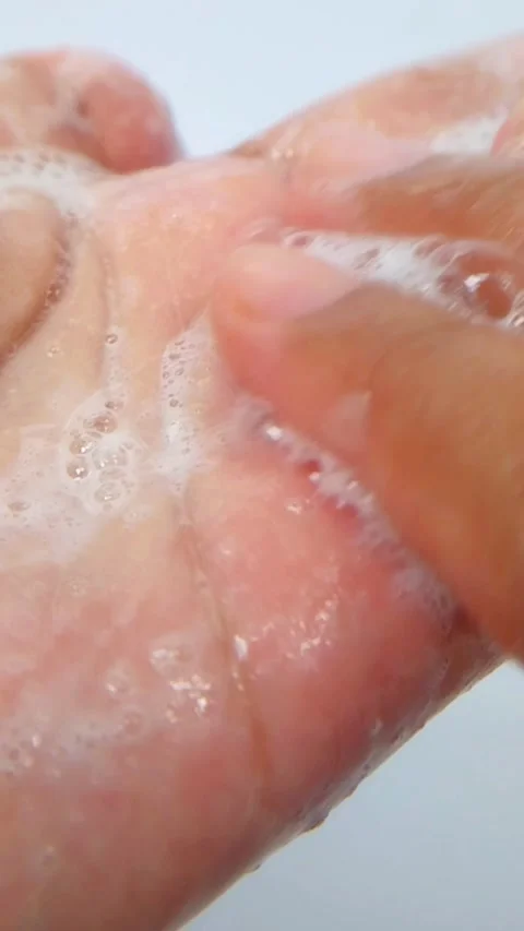 Close up of palm of hand filled with rich foam from soap, shampoo, and beau.. Stock Footage 335022550