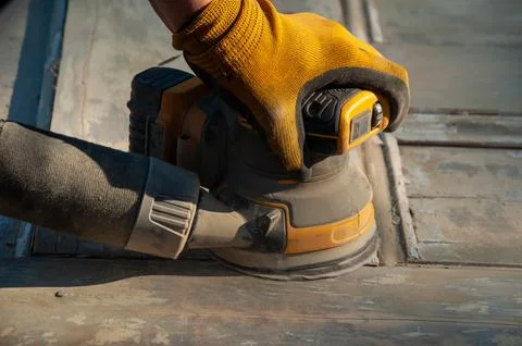A close-up of a palm sander at work Stock Photos