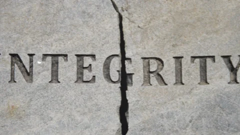 Close-Up Pan Across Broken Integrity Stone Plaque Stock Footage 316925406