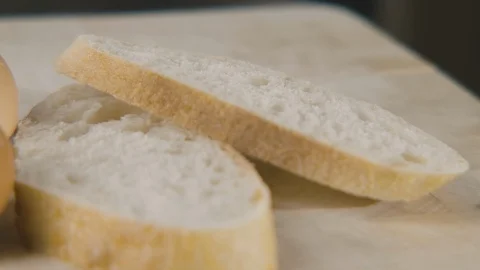 Close-up pan across eggs and bread. Stock Footage 129688166