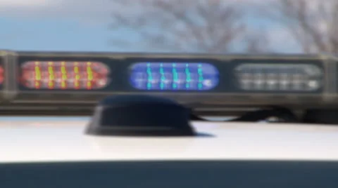 Close up pan across flashing emergency lights on police car. Stock Footage 41717841