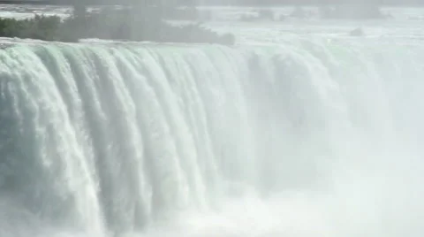 A close-up pan across Niagara Falls, with mist. Stock Footage 44115916