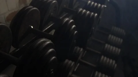 Close Up Pan Across Of Weights Lined Up On Weight Rack In Industrial Gym Old  Stock Footage 123063448