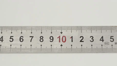 Close up pan along a section of a steel ruler Stock Footage 202066683